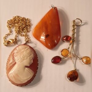 Cameo And Amber Pebdants